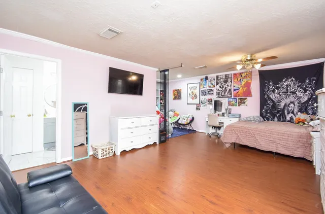 a bedroom with furniture and a window