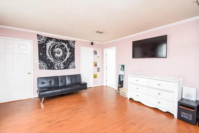 a room with gym equipment and a mirror