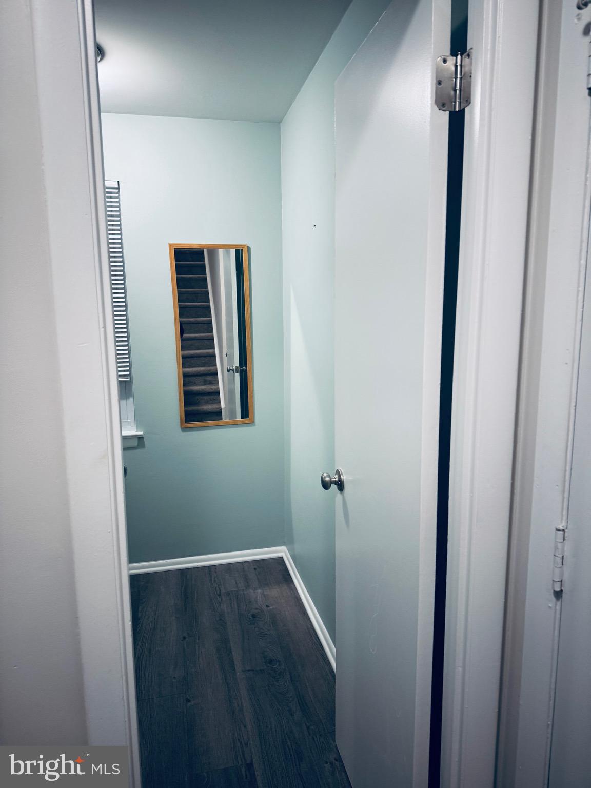 15839 Millbrook Lane, Unit 122 Laurel, MD 20707 - Photo 2 of 19 a view of hallway with wooden floor