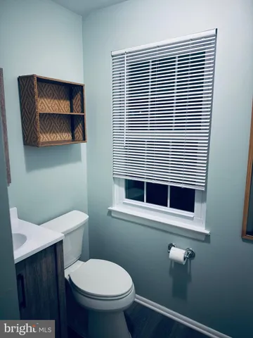a bathroom with a toilet and a sink
