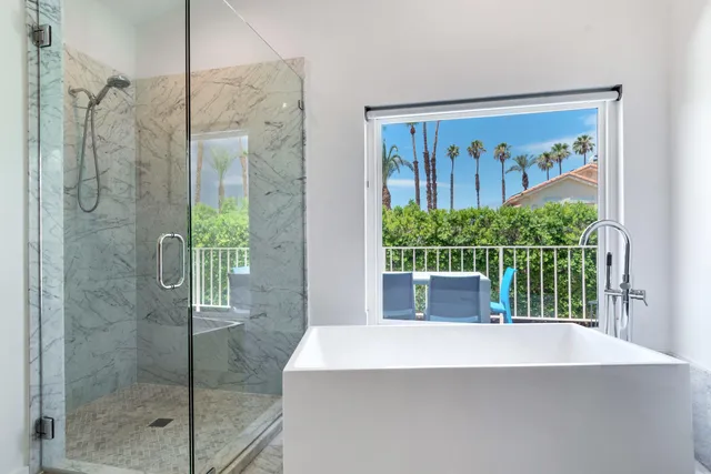 a bathroom with a shower and a view of bathroom