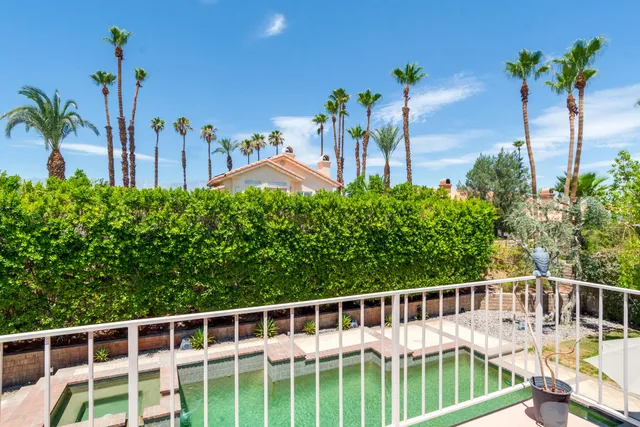 a view of a balcony with chairs