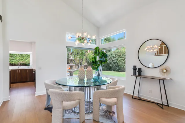 a living room with furniture a window and a table
