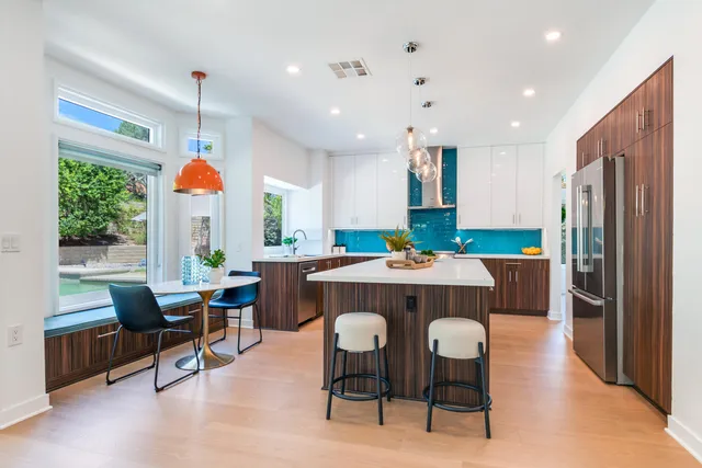 a dinning table and chairs in the kitchen