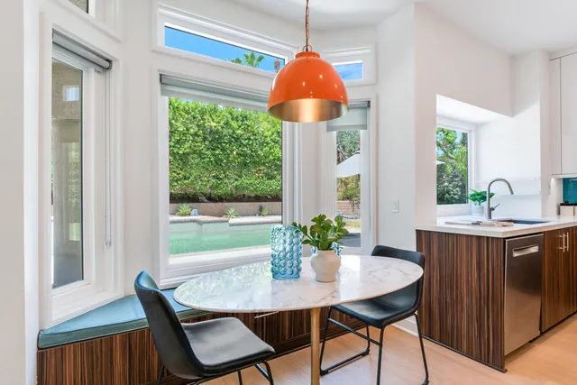 a view of a dining room with furniture window and outside view