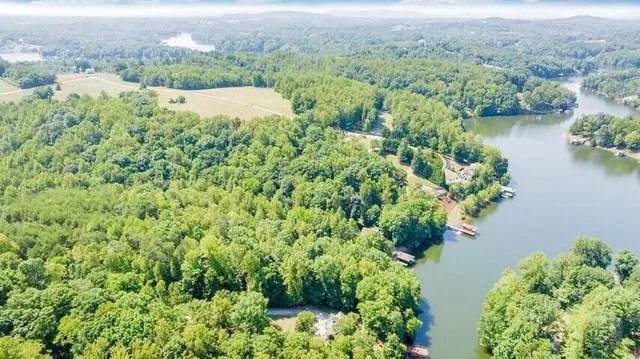 an aerial view of mountain with lake view