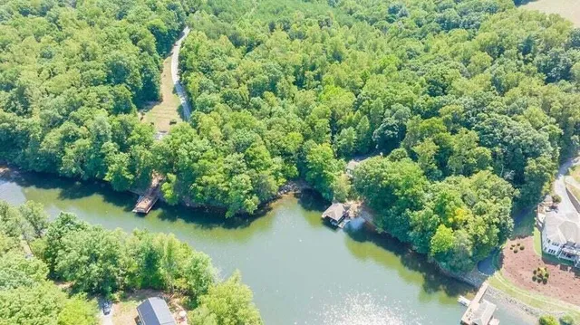 an aerial view of a house with yard
