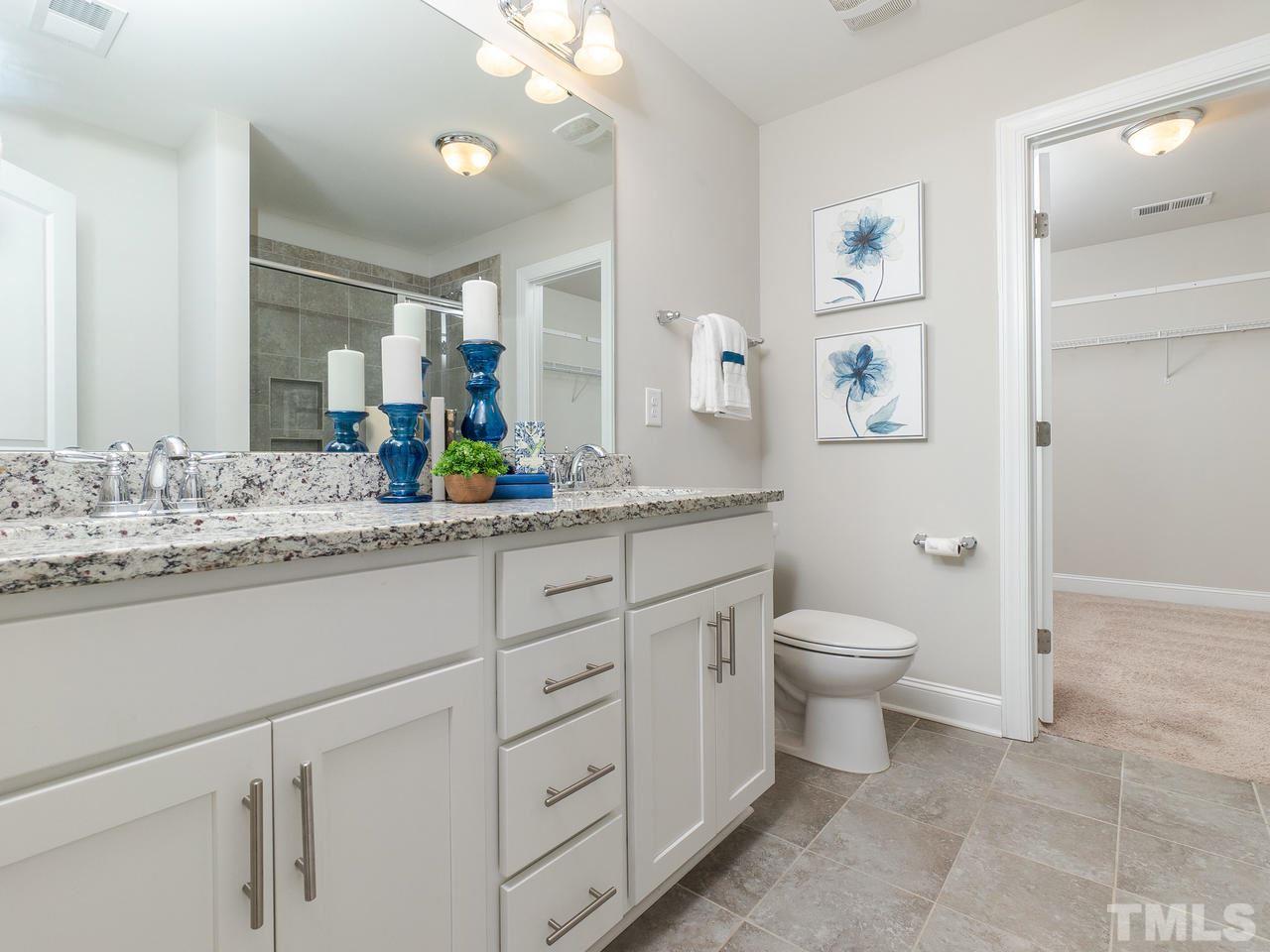 1132 Silver Farm Road Raleigh, NC 27603 - Photo 7 of 11 a bathroom with a granite countertop sink mirror and toilet