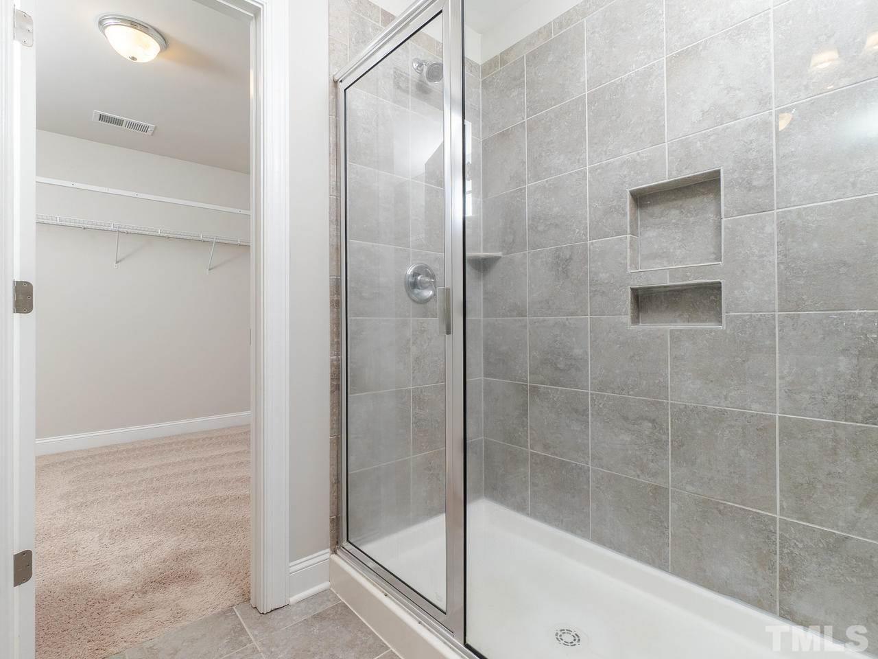 1132 Silver Farm Road Raleigh, NC 27603 - Photo 8 of 11 a bathroom with a shower