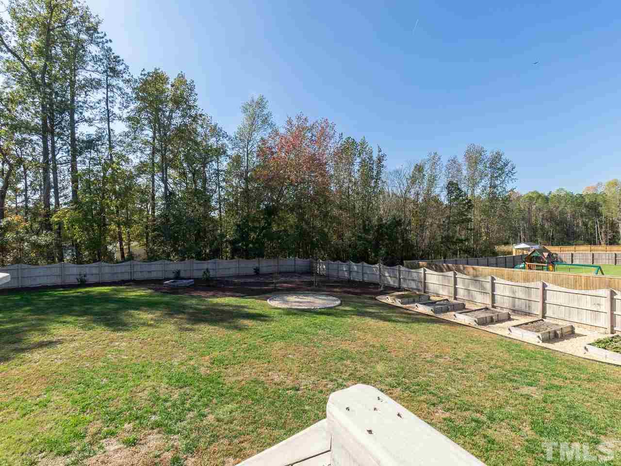 1132 Silver Farm Road Raleigh, NC 27603 - Photo 10 of 11 a view of a swimming pool with a patio