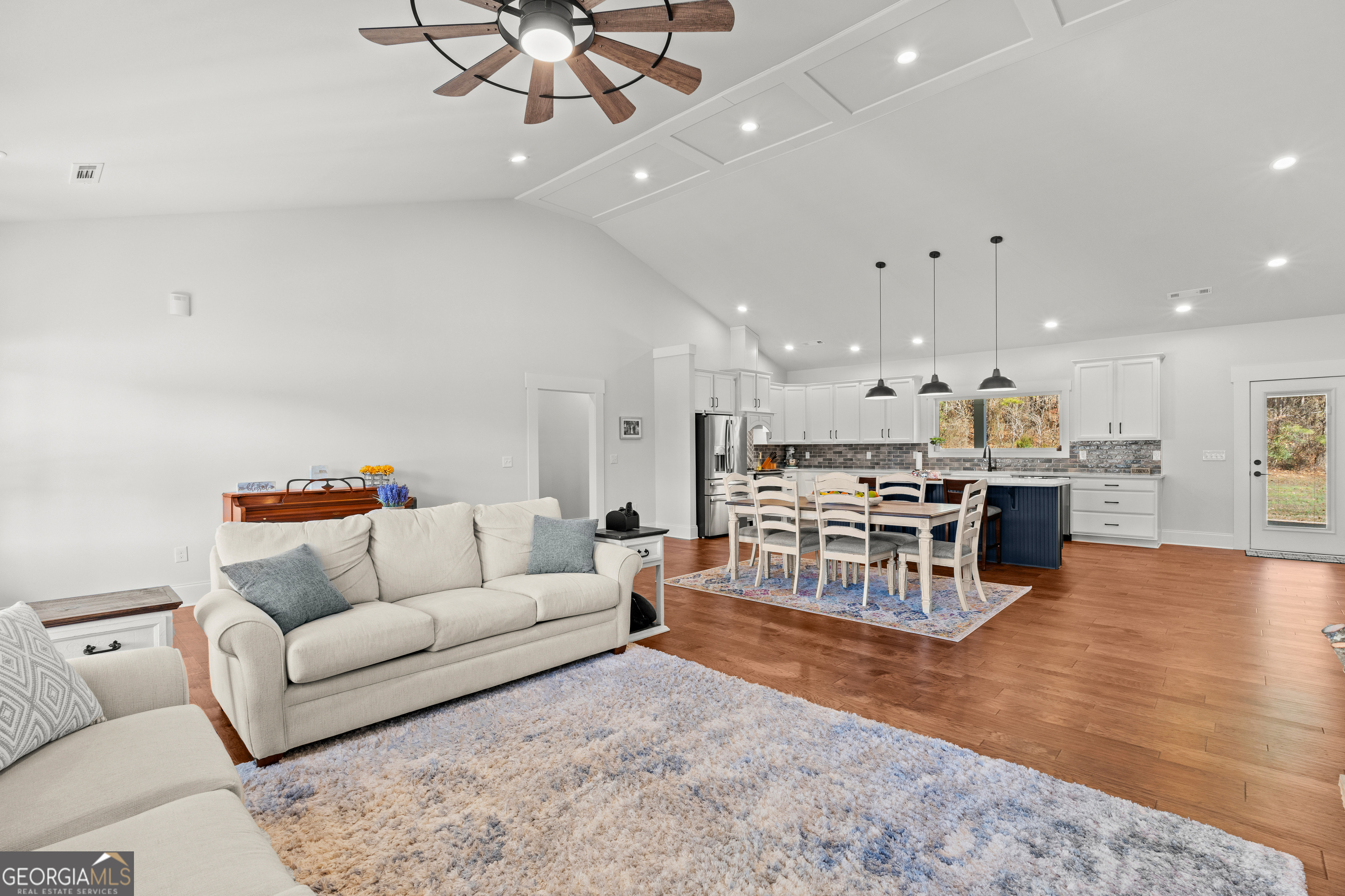 688 Central High Road Carrollton, GA 30116 - Photo 12 of 40 a living room with furniture and kitchen view