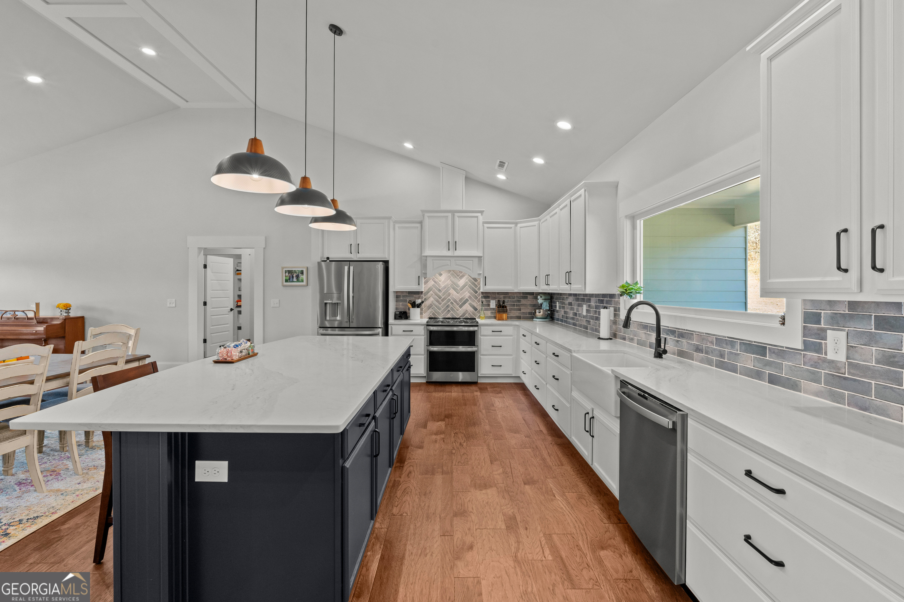 688 Central High Road Carrollton, GA 30116 - Photo 16 of 40 a large kitchen with a counter space a sink stainless steel appliances and cabinets
