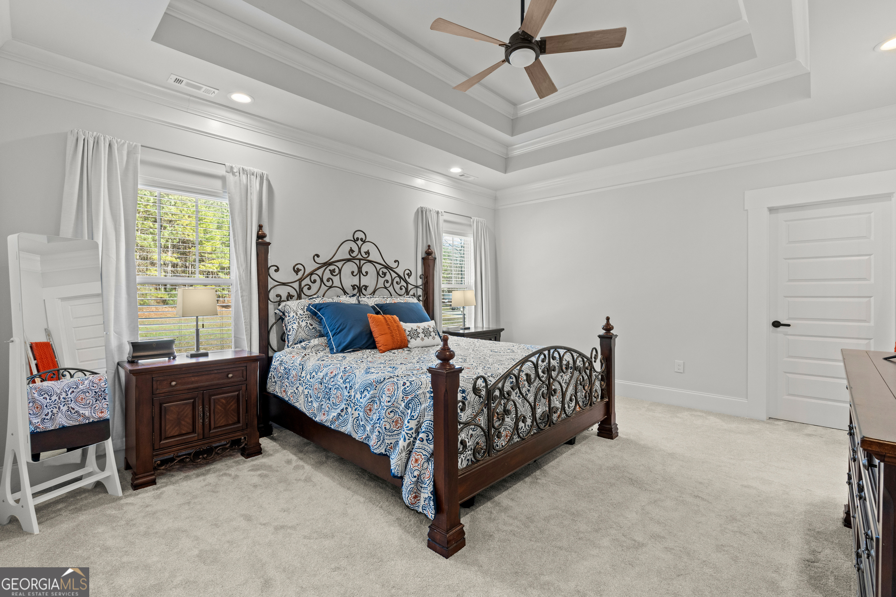 688 Central High Road Carrollton, GA 30116 - Photo 20 of 40 a bed sitting in a bedroom next to a window