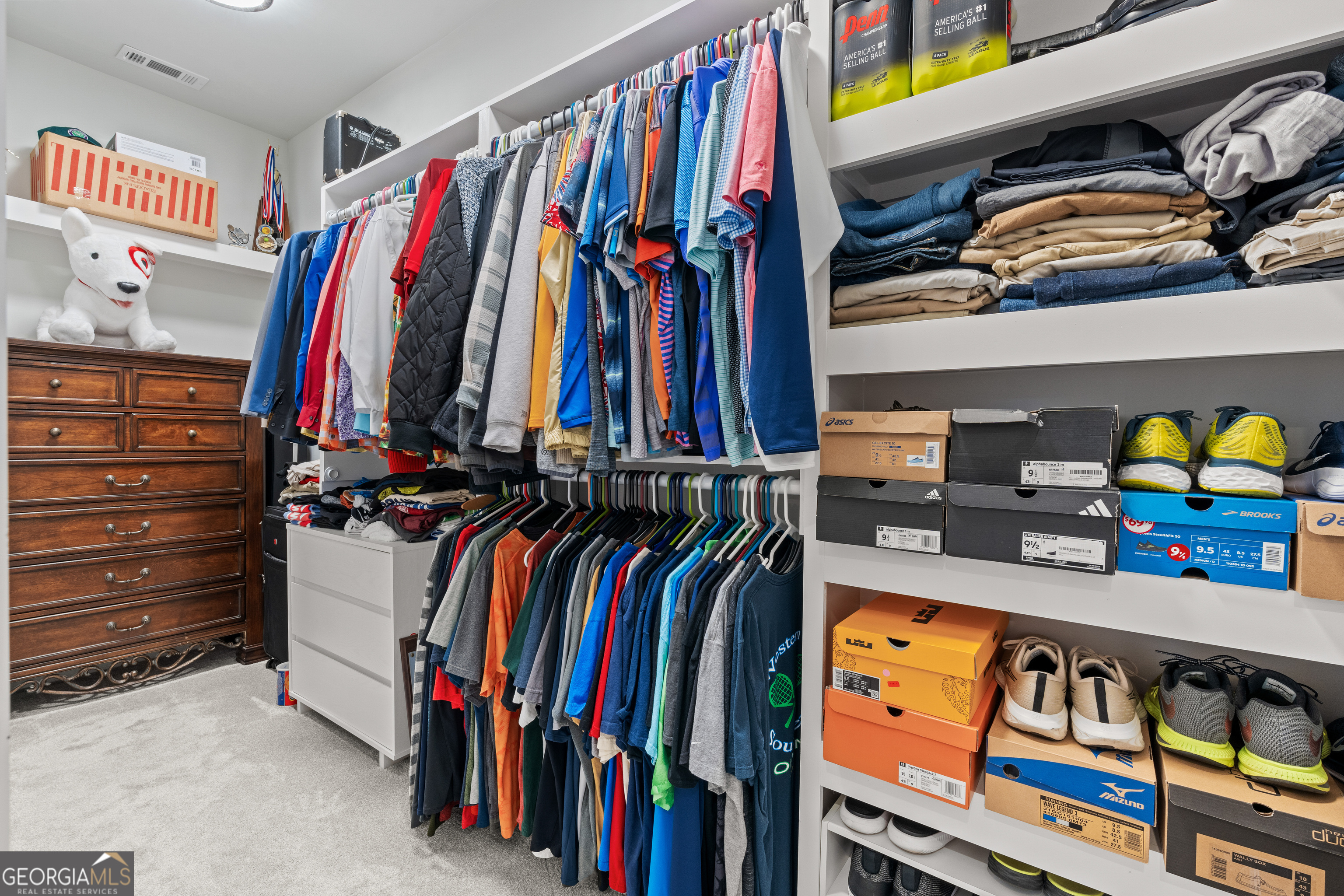 688 Central High Road Carrollton, GA 30116 - Photo 21 of 40 a view of walk in closet with clothes and shoes