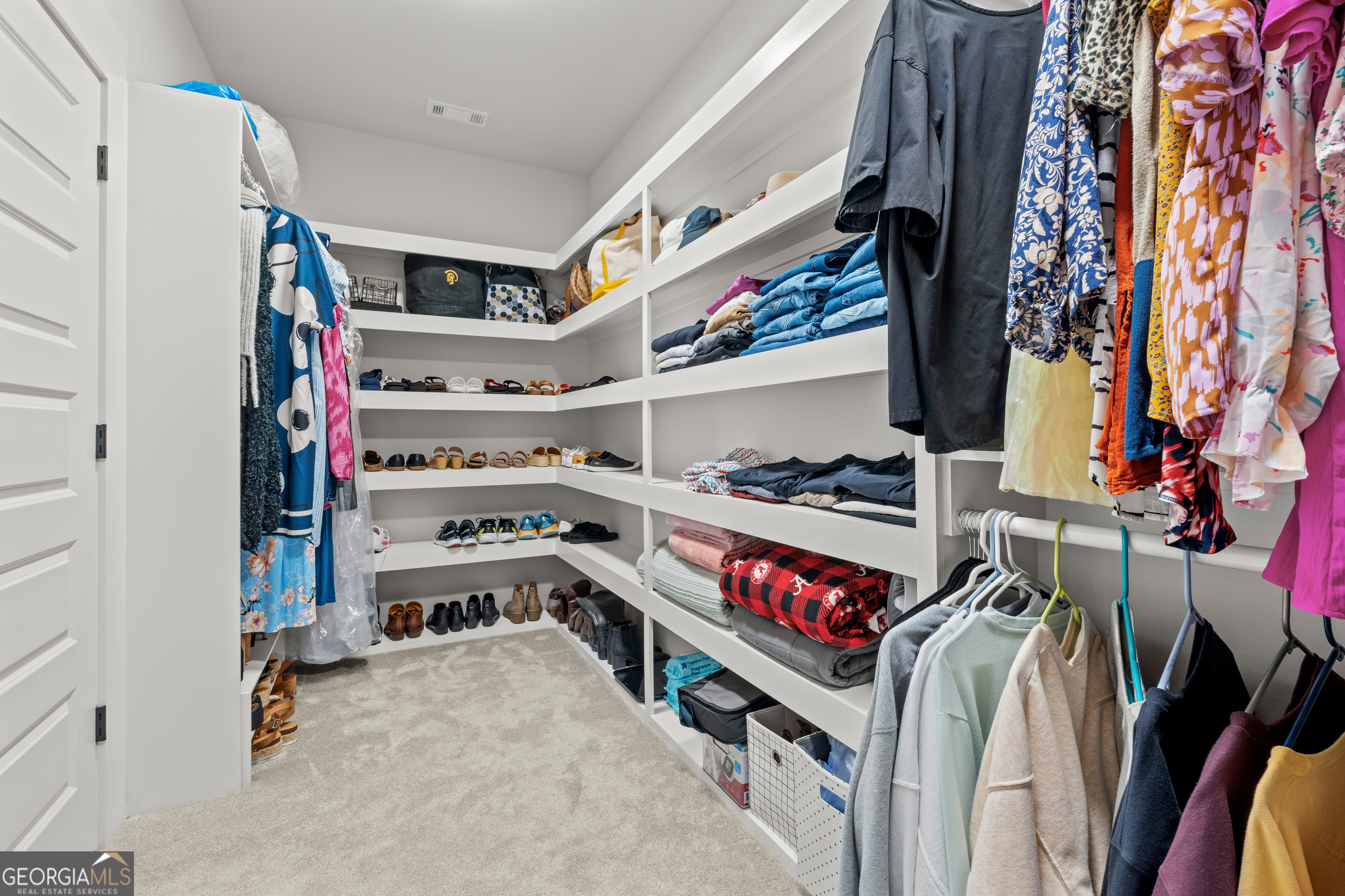 688 Central High Road Carrollton, GA 30116 - Photo 25 of 40 a view of walk in closet with clothes and shoes