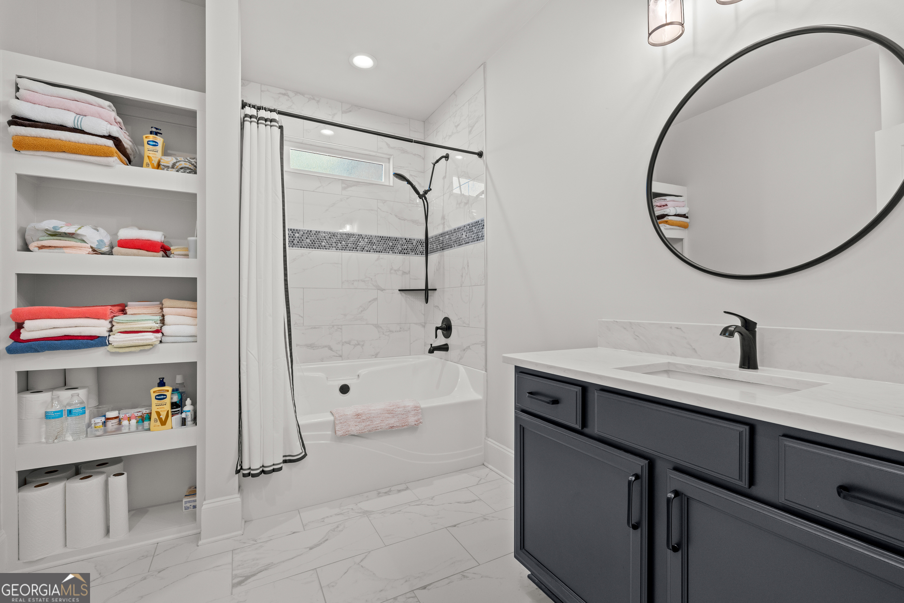 688 Central High Road Carrollton, GA 30116 - Photo 30 of 40 a bathroom with a sink and a mirror