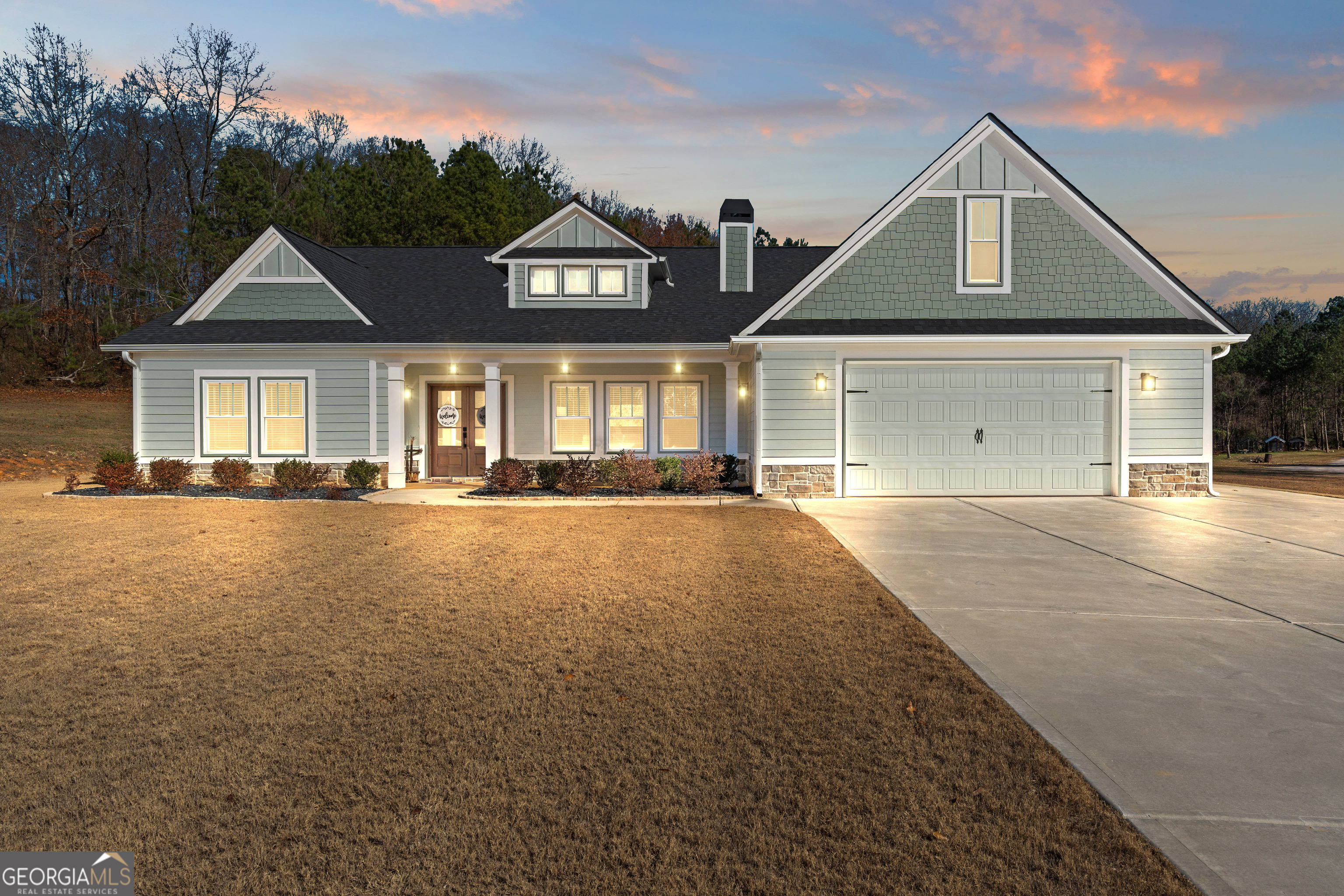 688 Central High Road Carrollton, GA 30116 - Photo 3 of 40 a front view of a house with a yard
