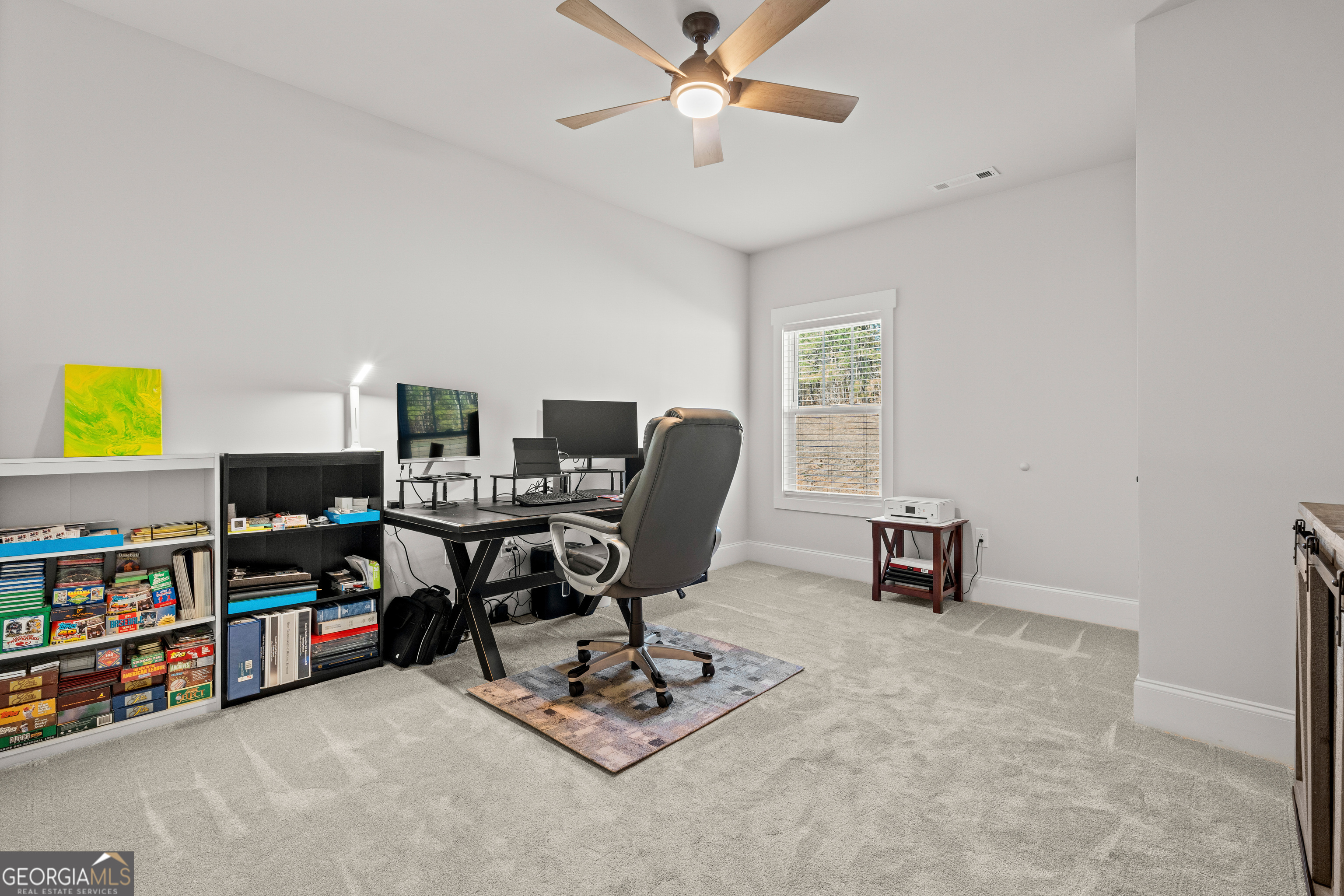 688 Central High Road Carrollton, GA 30116 - Photo 32 of 40 a view of a workspace with furniture and a window