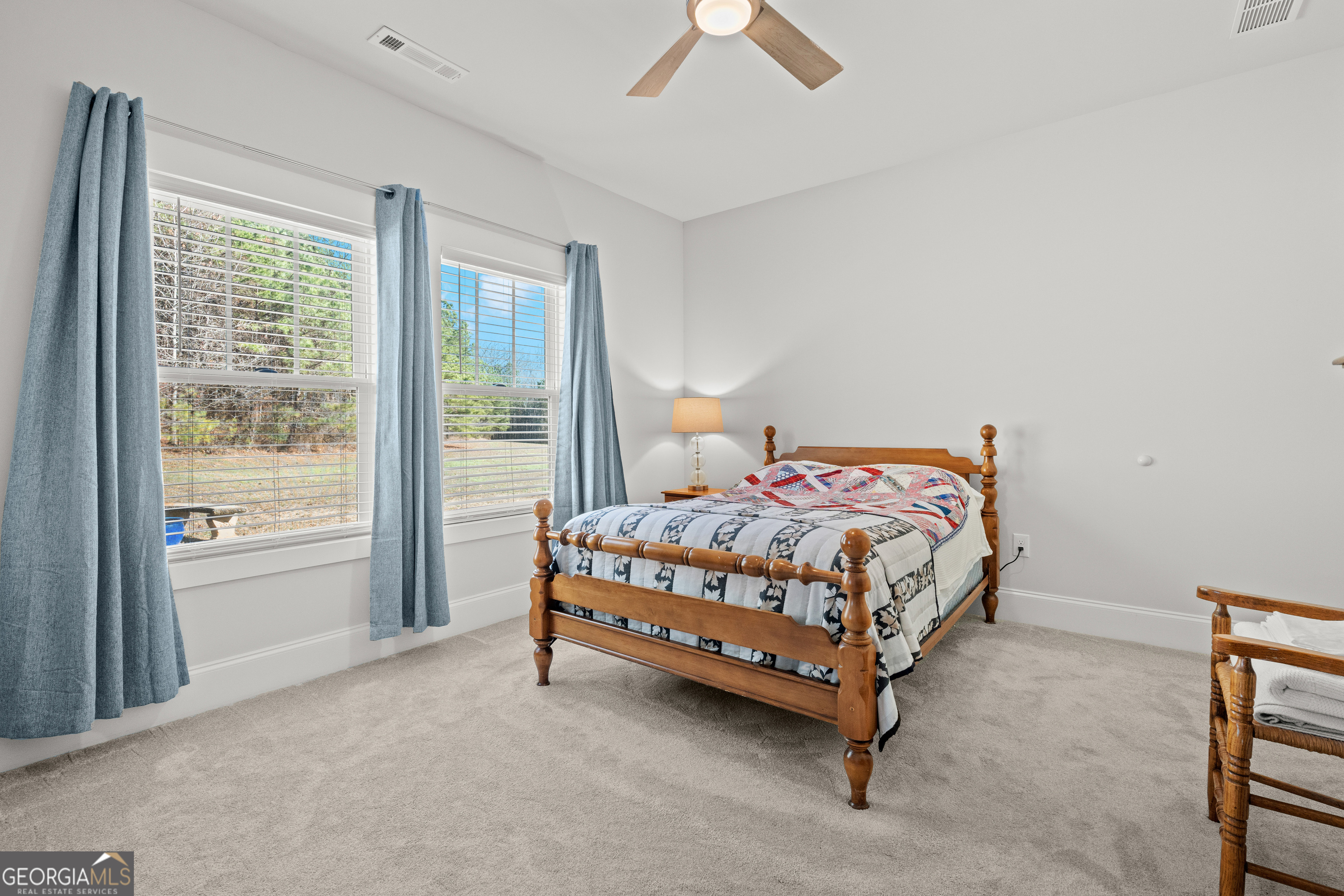 688 Central High Road Carrollton, GA 30116 - Photo 33 of 40 a bed sitting in a bedroom next to a window