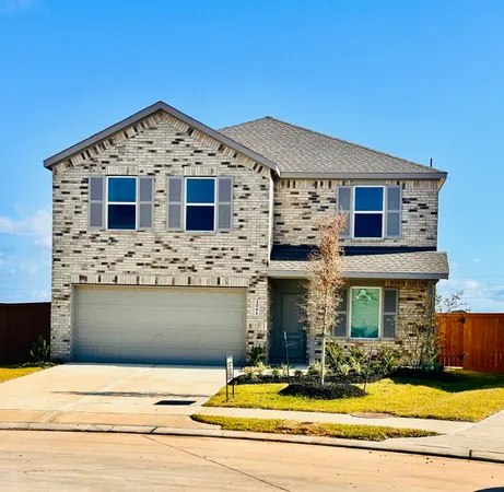 a front view of a house with yard