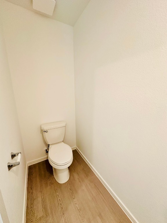 3041 Merganser Rdg Drive Katy, TX 77493 - Photo 12 of 28 a white toilet sitting in a bathroom