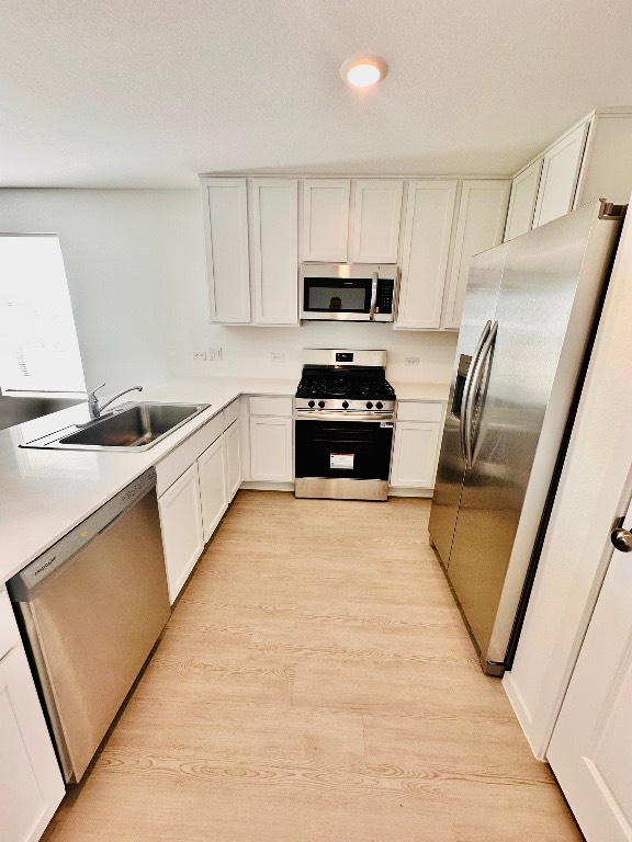3041 Merganser Rdg Drive Katy, TX 77493 - Photo 8 of 28 a kitchen with granite countertop a refrigerator stove top oven and sink