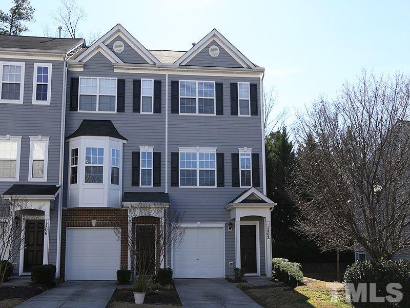 1402 Holly Grove Way Durham, NC 27713 - Photo 1 of 19 a front view of a house with a yard