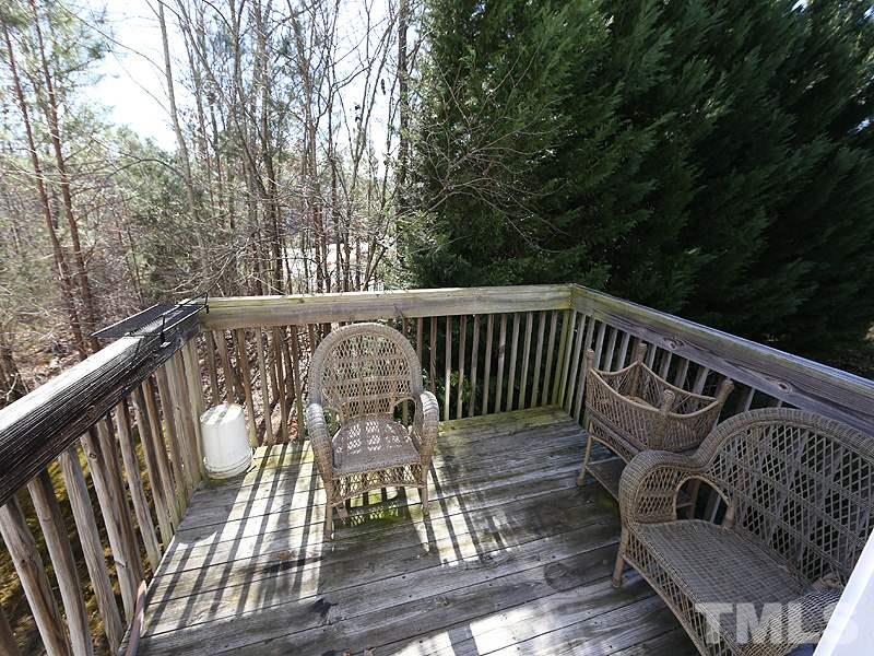 1402 Holly Grove Way Durham, NC 27713 - Photo 11 of 19 a view of balcony with wooden floor and outdoor seating