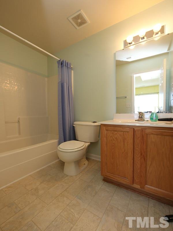 1402 Holly Grove Way Durham, NC 27713 - Photo 16 of 19 a bathroom with a toilet a sink and bathtub