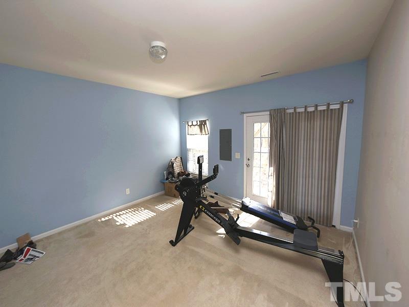 1402 Holly Grove Way Durham, NC 27713 - Photo 17 of 19 a view of a room with gym equipment
