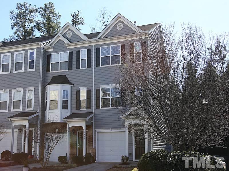 1402 Holly Grove Way Durham, NC 27713 - Photo 3 of 19 a front view of a house with a yard