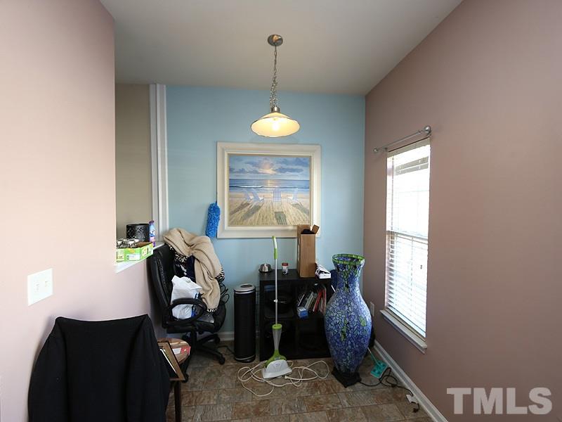 1402 Holly Grove Way Durham, NC 27713 - Photo 5 of 19 a view of a workspace with furniture and a window