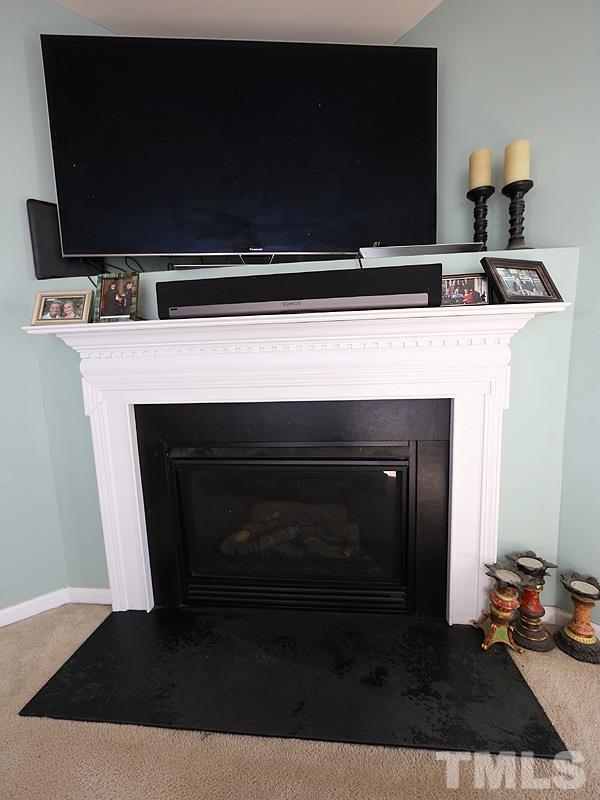 1402 Holly Grove Way Durham, NC 27713 - Photo 10 of 19 a kitchen with a stove and a microwave