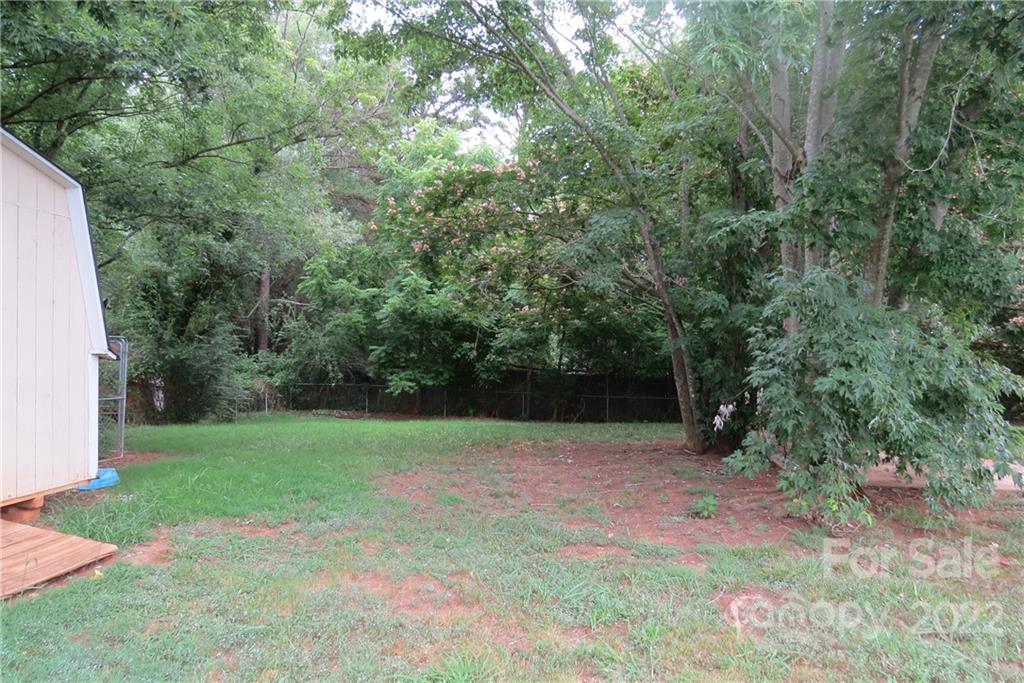 1316 Mayberry Road Dallas, NC 28034 - Photo 18 of 23 a backyard of a house with lots of green space