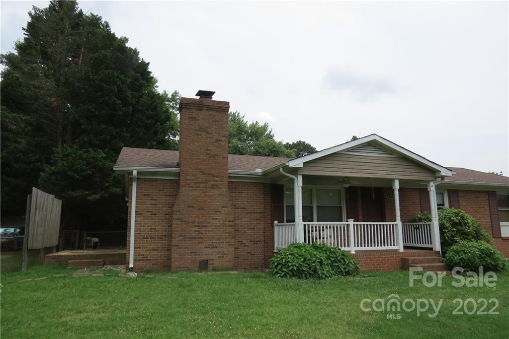 1316 Mayberry Road Dallas, NC 28034 - Photo 2 of 23 a view of front of house with a yard