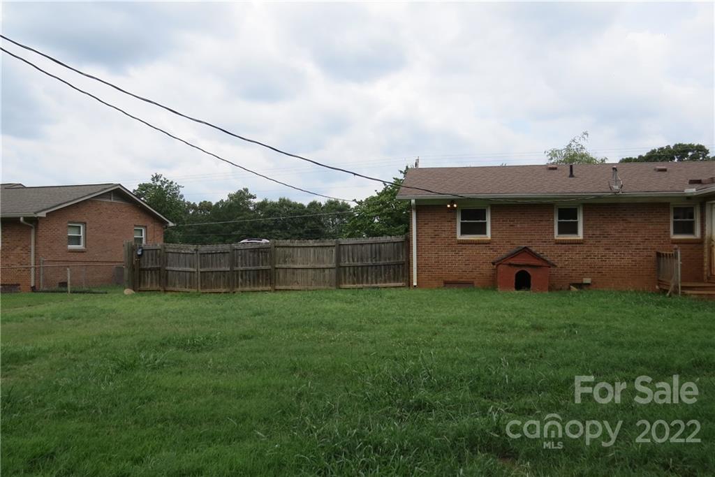1316 Mayberry Road Dallas, NC 28034 - Photo 23 of 23 a backyard of a house with lots of green space