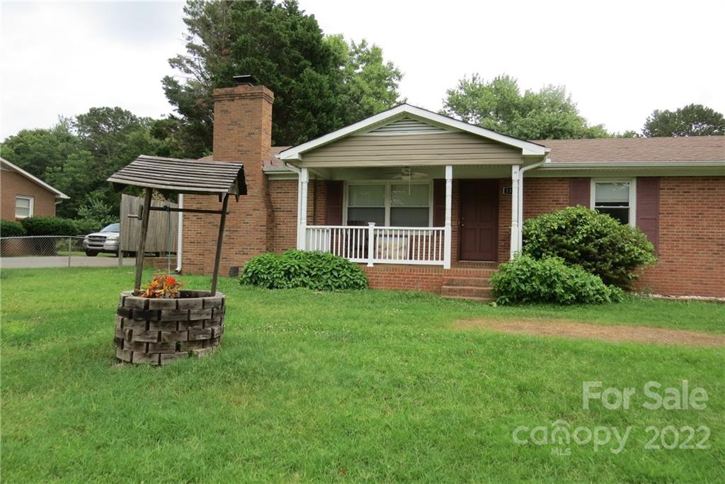 1316 Mayberry Road Dallas, NC 28034 - Photo 3 of 23 a front view of a house with a garden