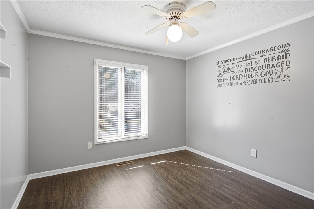 308 Wildwood Road Walhalla, SC 29691 - Photo 15 of 23 This inviting bedroom features rich wood flooring and a refreshing ceiling fan.