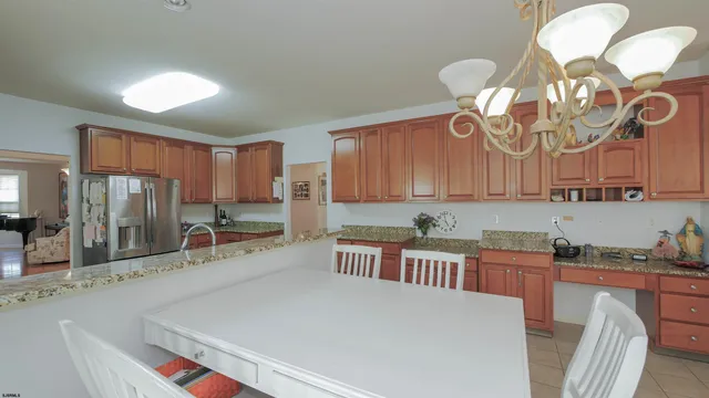 a kitchen with lots of counter top space and stainless steel appliances