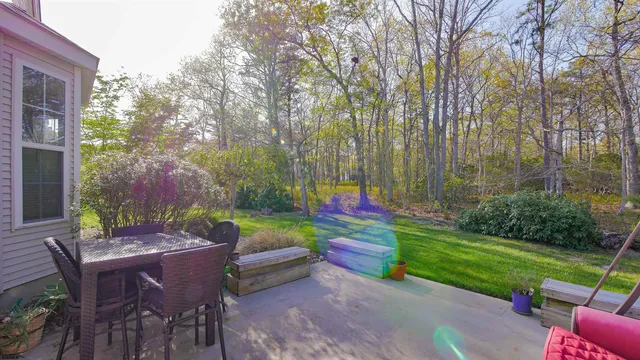 a backyard of a house with outdoor seating