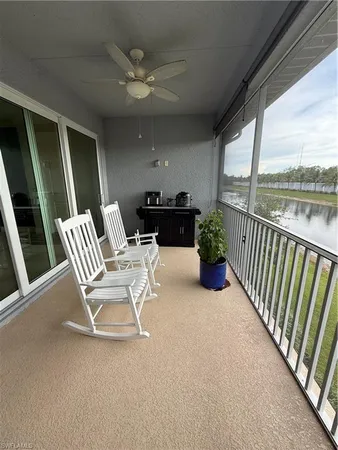 a view of two chairs in the balcony