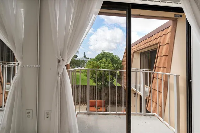 a view of balcony with small garden