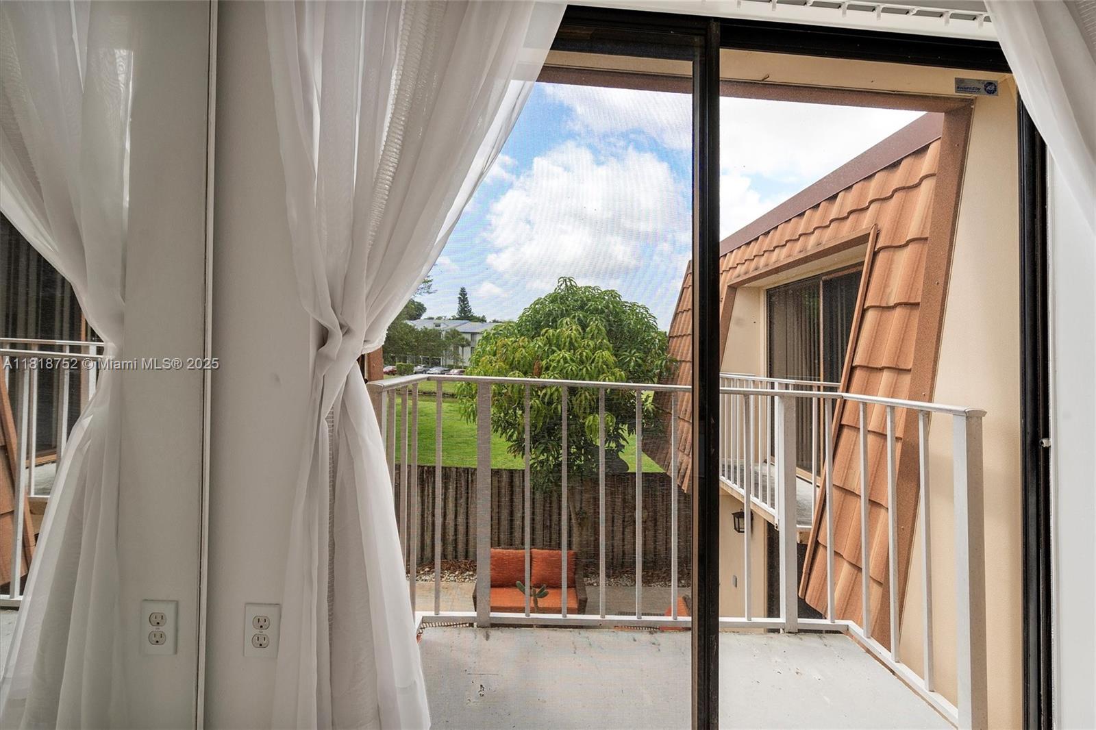 839 Blue Ridge Circle, Unit 839 West Palm Beach, FL 33409 - Photo 17 of 34 a view of balcony with small garden
