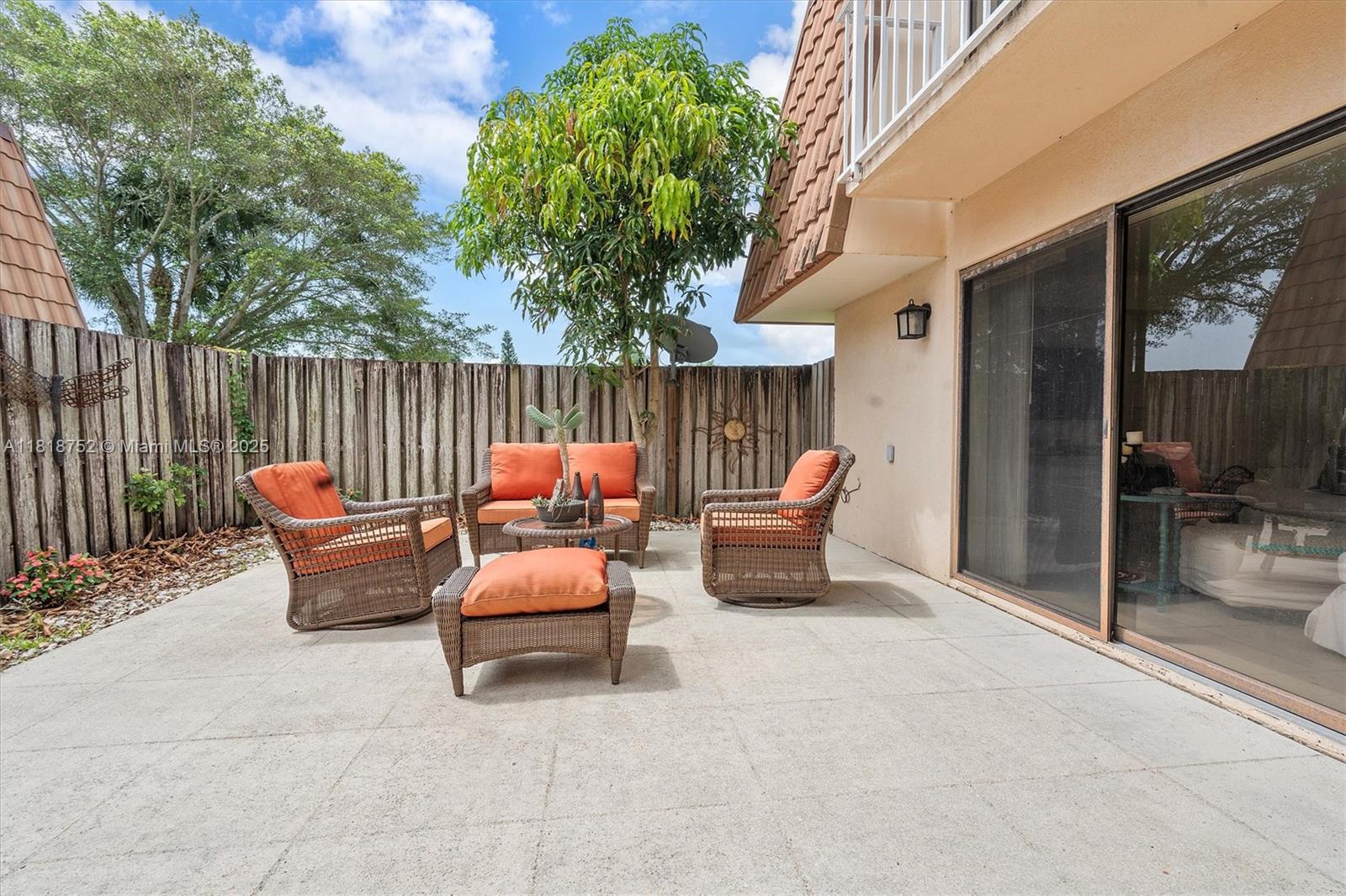 839 Blue Ridge Circle, Unit 839 West Palm Beach, FL 33409 - Photo 20 of 34 a patio with patio a couch and chairs