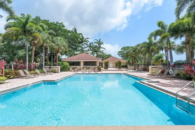 a view of a swimming pool with a lounge chairs