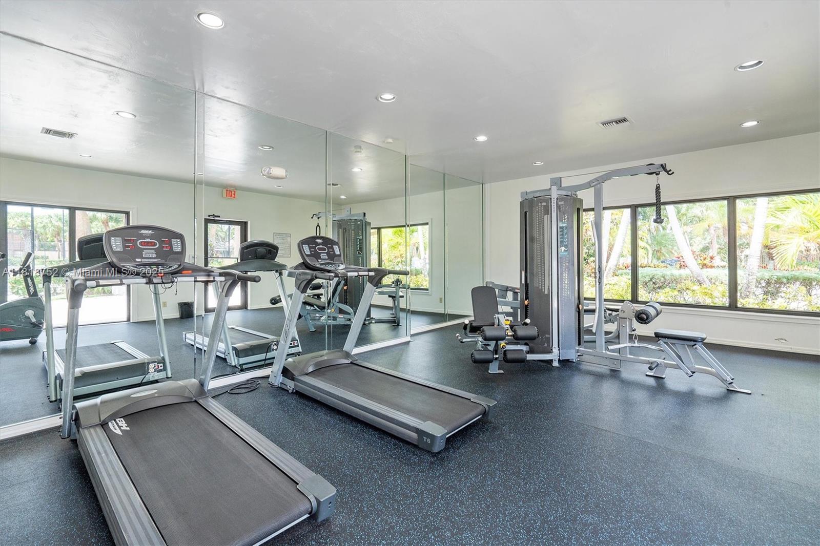 839 Blue Ridge Circle, Unit 839 West Palm Beach, FL 33409 - Photo 29 of 34 a view of a room with gym equipment