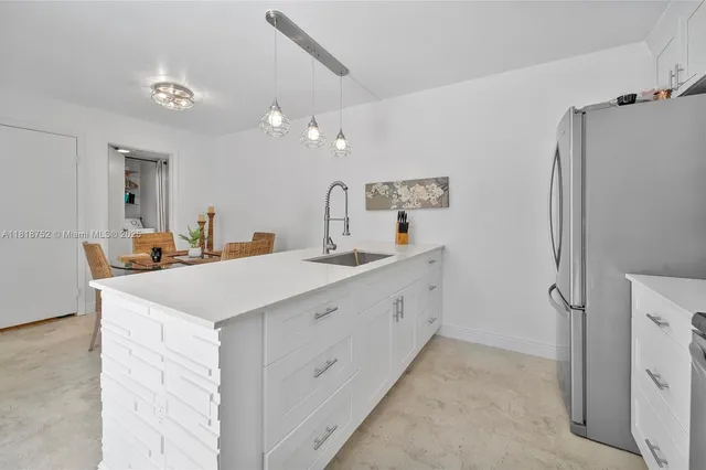 a spacious bathroom with a double vanity sink mirror and shower