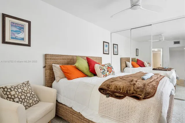 a bedroom with bed and a couch