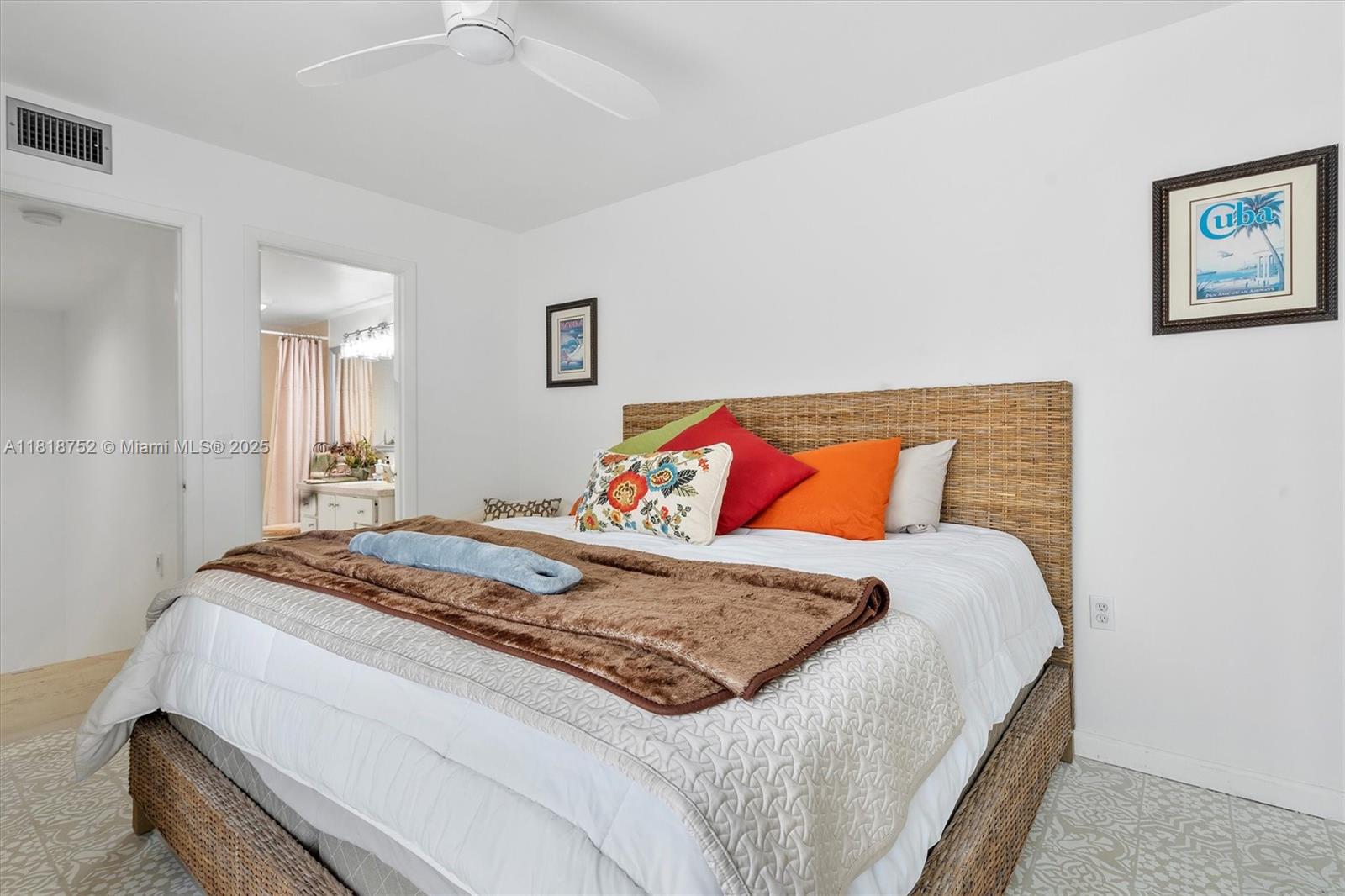 839 Blue Ridge Circle, Unit 839 West Palm Beach, FL 33409 - Photo 9 of 34 a bedroom with a bed and a painting on the wall