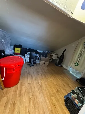 a bedroom with a bed and a tv